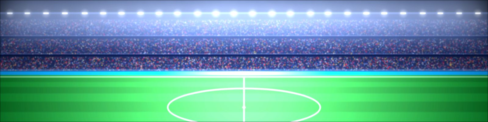 A floodlit football stadium at night